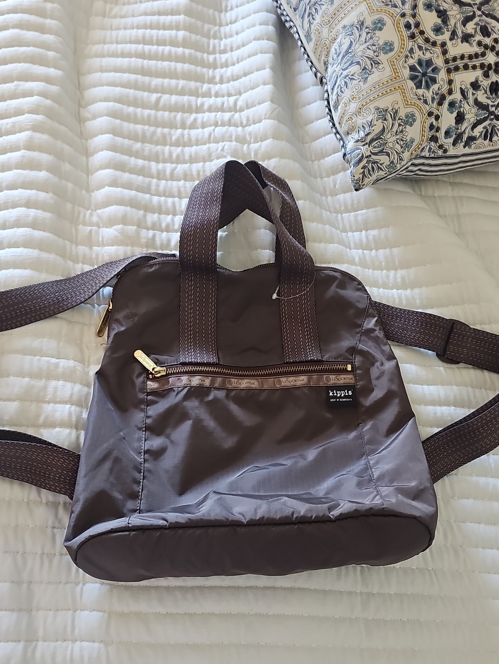 Lesportsac brown nylon mini backpack with gold-tone zipper